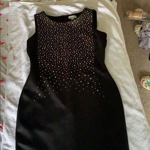 Black cocktail dress with gold design on front